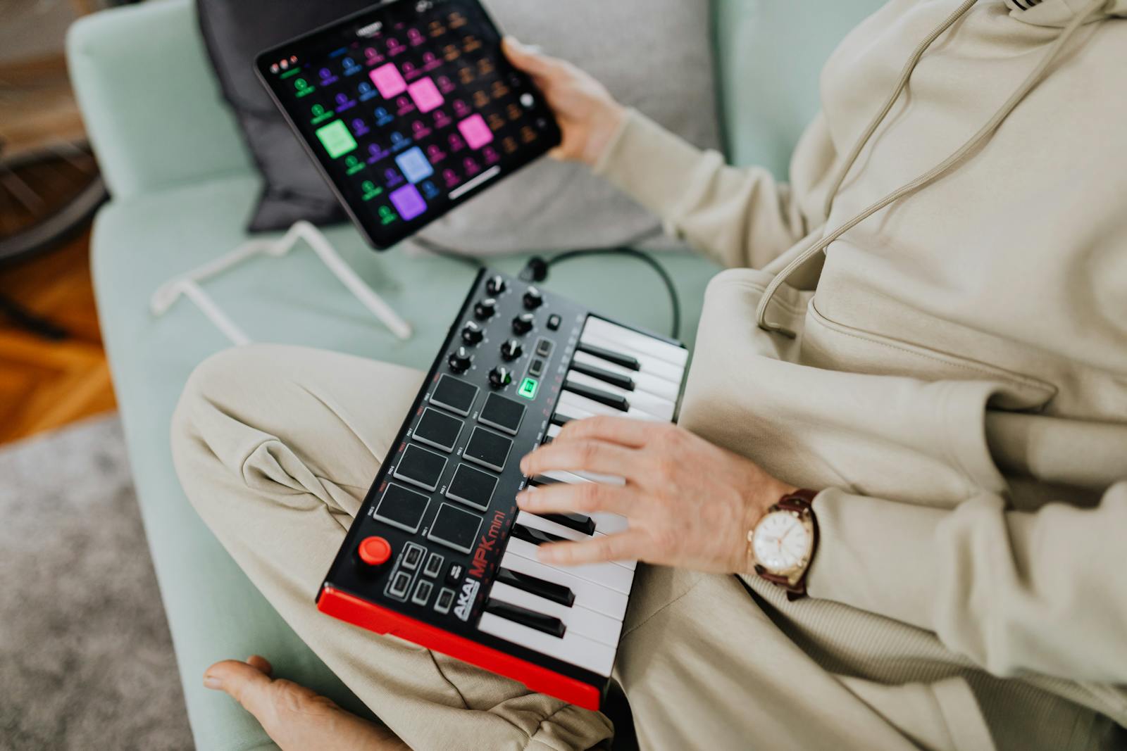 Hands of a Man Using a MIDI Controller