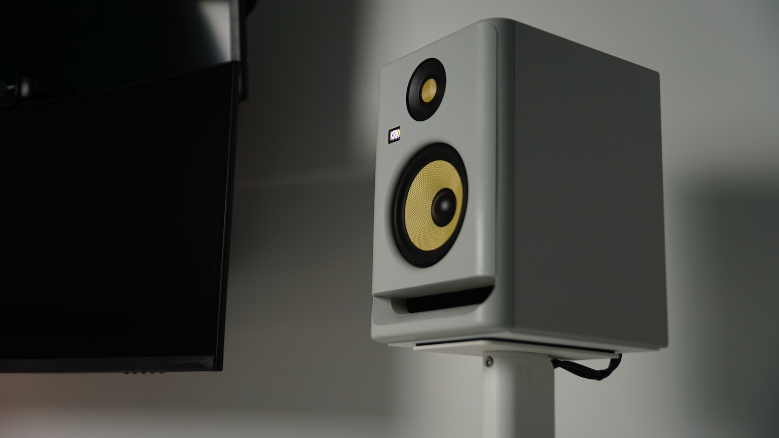 a close up of a speaker on a stand