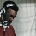 a man wearing headphones and a microphone
