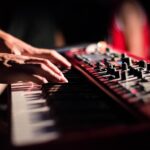 selective focus photo of person playing electric guitar