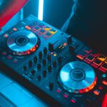 black dj controller turned on in dim light room