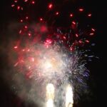 a group of people watching a fireworks show